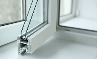 Cross-section of a custom vinyl window frame showing double-pane glass and internal structural chambers.
